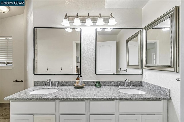 bathroom with vanity and tile patterned flooring