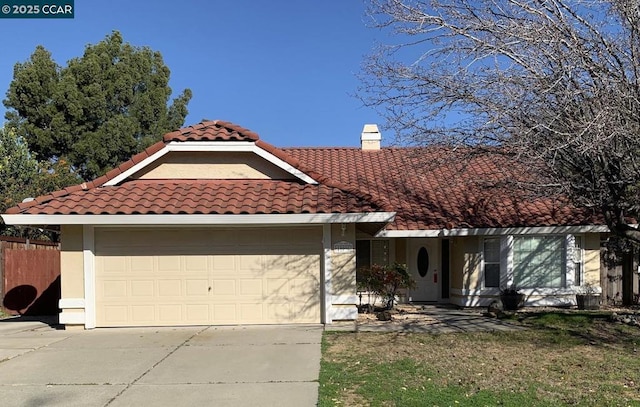 mediterranean / spanish-style house featuring a garage