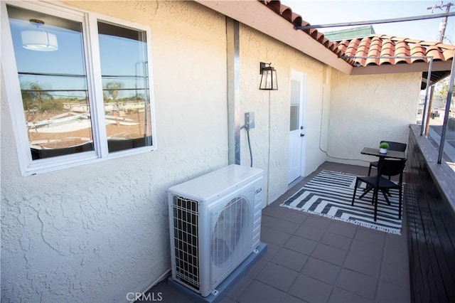 exterior space with a balcony and ac unit