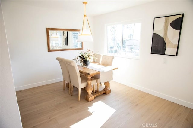 dining area with light wood-type flooring