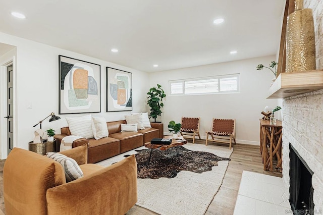 living room featuring light hardwood / wood-style floors and a fireplace