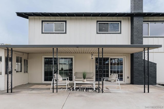 back of property featuring a patio