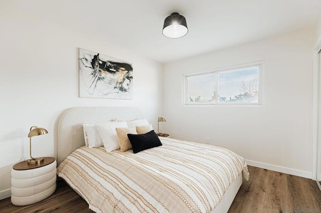 bedroom with hardwood / wood-style flooring