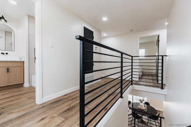 staircase featuring hardwood / wood-style flooring