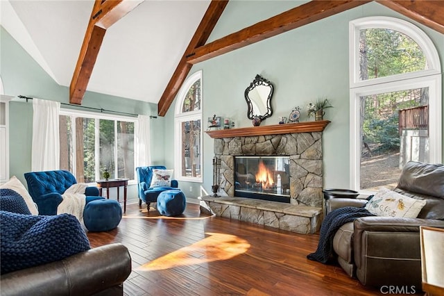 living room with high vaulted ceiling, beam ceiling, a stone fireplace, and hardwood / wood-style floors