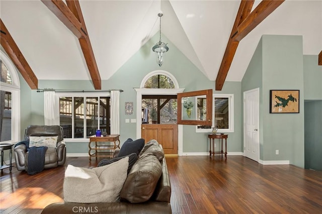 living room with beam ceiling, a healthy amount of sunlight, dark hardwood / wood-style flooring, and high vaulted ceiling