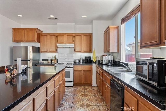 kitchen with sink, light tile patterned floors, stainless steel fridge, dishwasher, and white range with gas stovetop