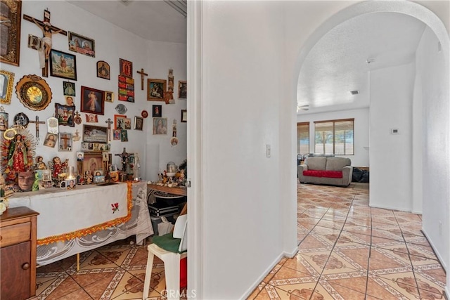 corridor with light tile patterned floors