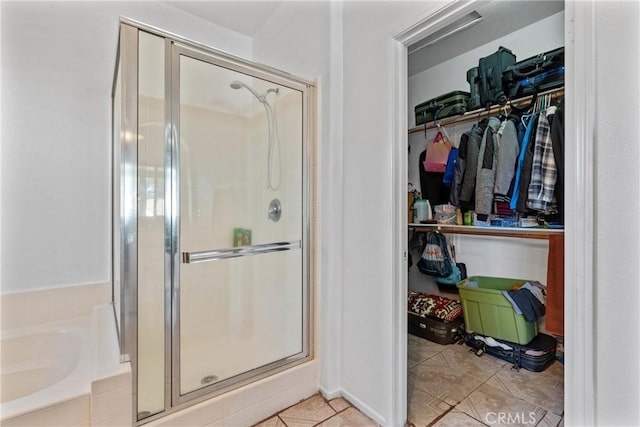 bathroom featuring tile patterned floors and plus walk in shower