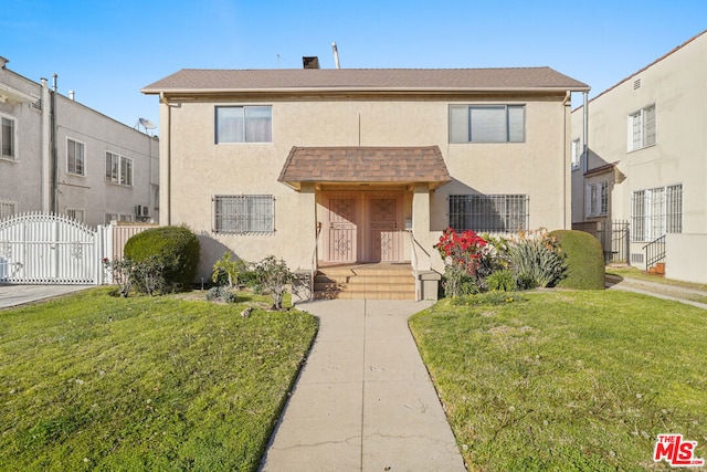 view of front of home with a front lawn