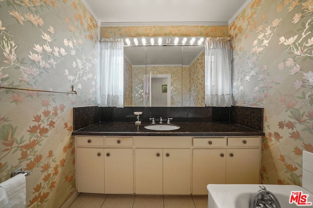 bathroom with a healthy amount of sunlight, tile patterned floors, and ornamental molding