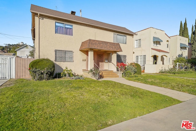 view of front of home with a front lawn