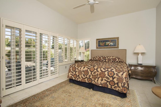 bedroom with tile patterned flooring, access to exterior, and ceiling fan