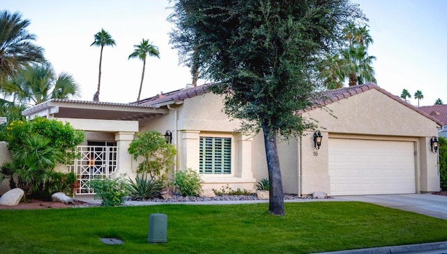 ranch-style home with a garage and a front lawn