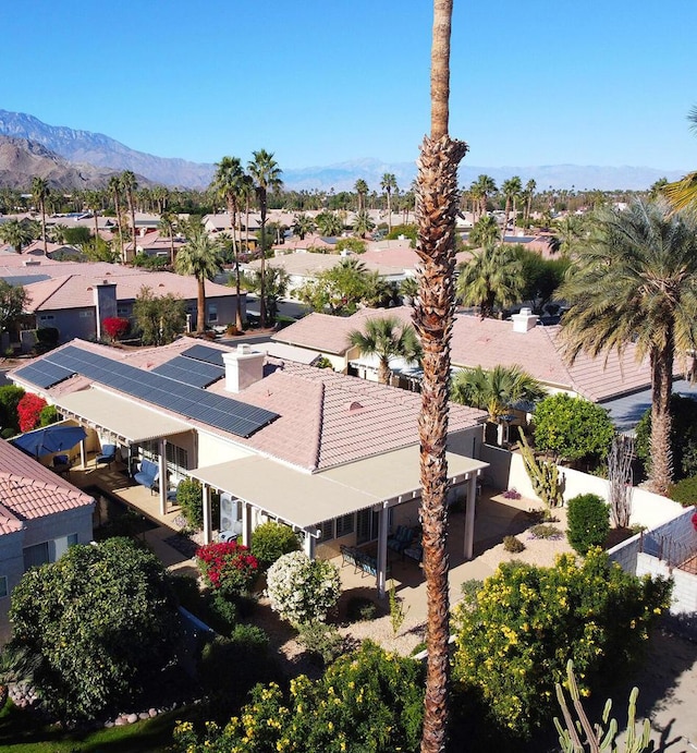 birds eye view of property featuring a mountain view