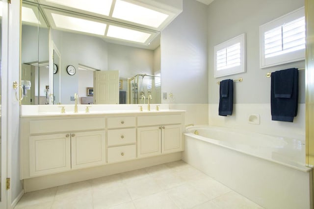 bathroom featuring tile patterned floors, vanity, and independent shower and bath