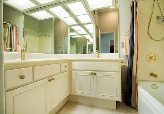 bathroom featuring tile patterned floors, vanity, and shower / bath combo