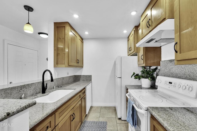 kitchen featuring pendant lighting, sink, white appliances, light tile patterned floors, and light stone counters