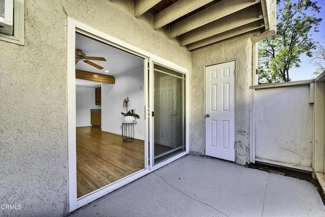 entrance to property featuring a patio