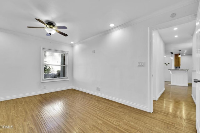 unfurnished room with light hardwood / wood-style floors, crown molding, and ceiling fan