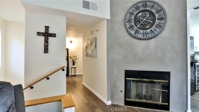 hallway with dark hardwood / wood-style flooring