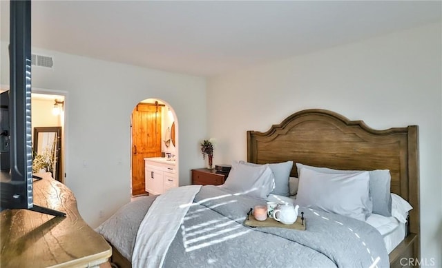 bedroom featuring ensuite bath