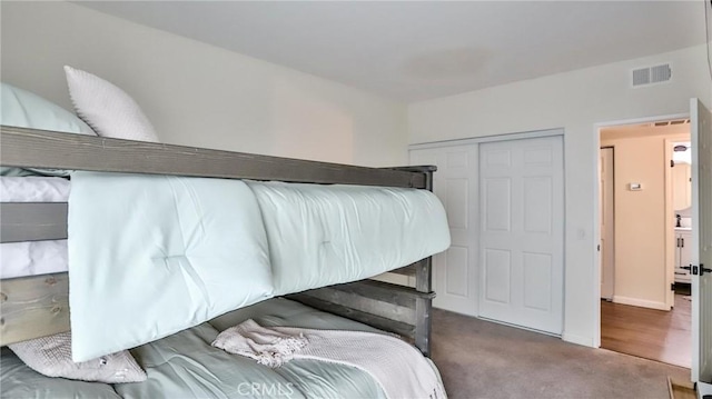 bedroom featuring a closet and carpet flooring