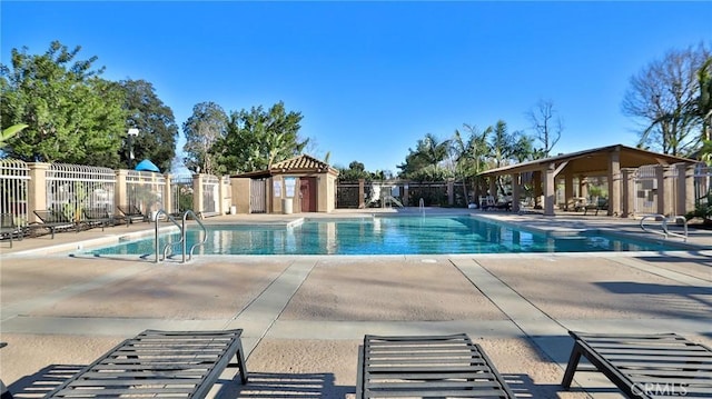 view of swimming pool featuring a patio area