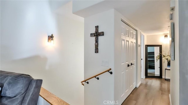 corridor featuring light hardwood / wood-style flooring