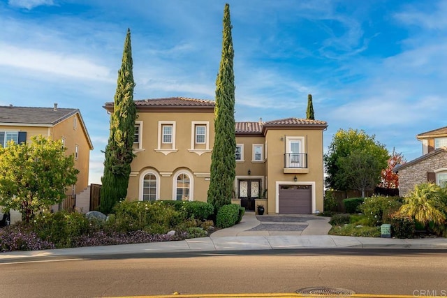 mediterranean / spanish-style house featuring a garage