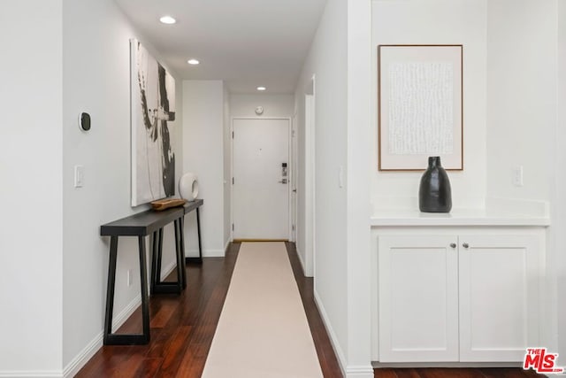 hallway featuring dark wood-type flooring