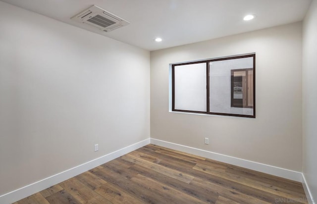 unfurnished room featuring dark hardwood / wood-style floors