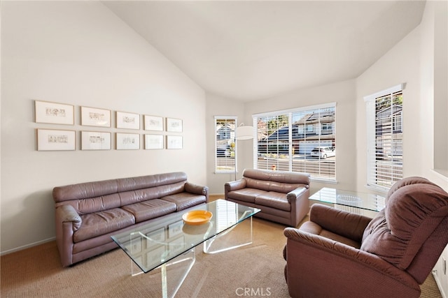 living room with light carpet and vaulted ceiling