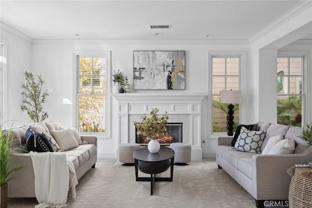 carpeted living room with ornamental molding