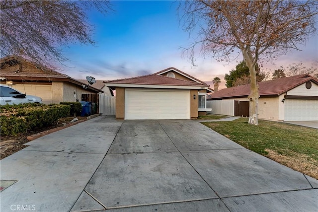 ranch-style home with a yard