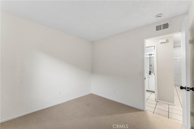 carpeted empty room featuring sink