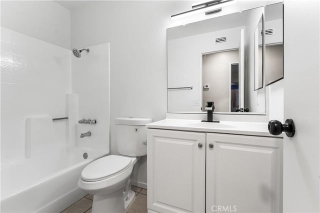 full bathroom featuring toilet, vanity, tile patterned floors, and washtub / shower combination