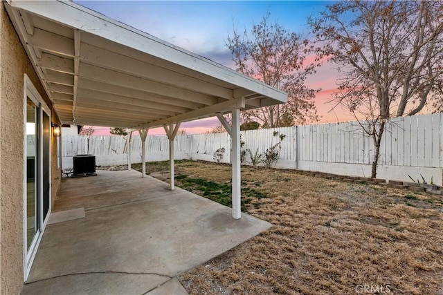 patio terrace at dusk with central AC unit