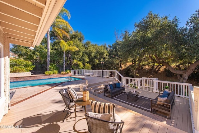 view of swimming pool with a deck and an outdoor hangout area