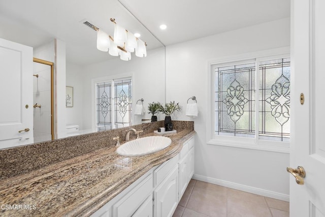 bathroom with toilet, an enclosed shower, tile patterned flooring, an inviting chandelier, and vanity