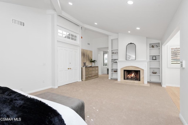 carpeted bedroom featuring lofted ceiling