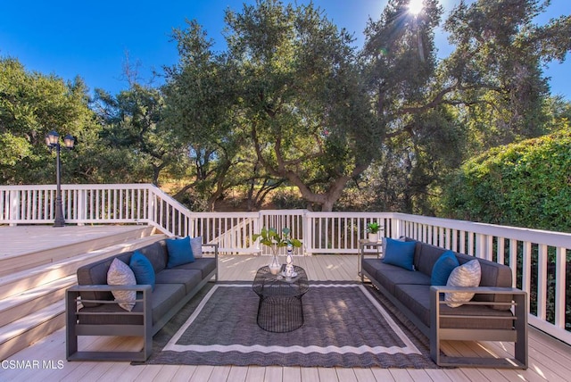 wooden deck with outdoor lounge area