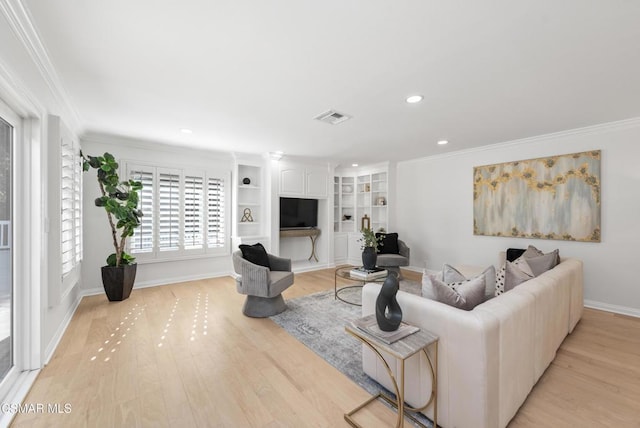 living room with built in features, light hardwood / wood-style flooring, and ornamental molding