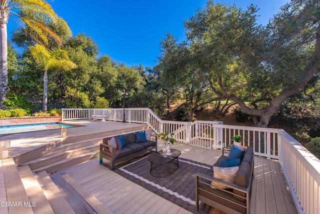 wooden terrace featuring outdoor lounge area