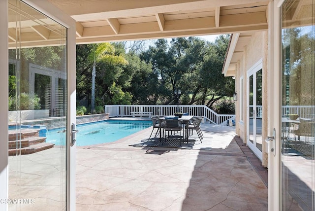 view of swimming pool featuring a patio