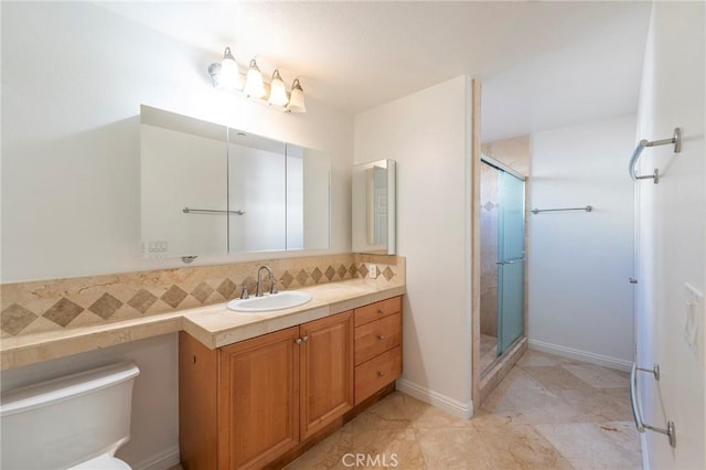 bathroom with vanity and a shower with door