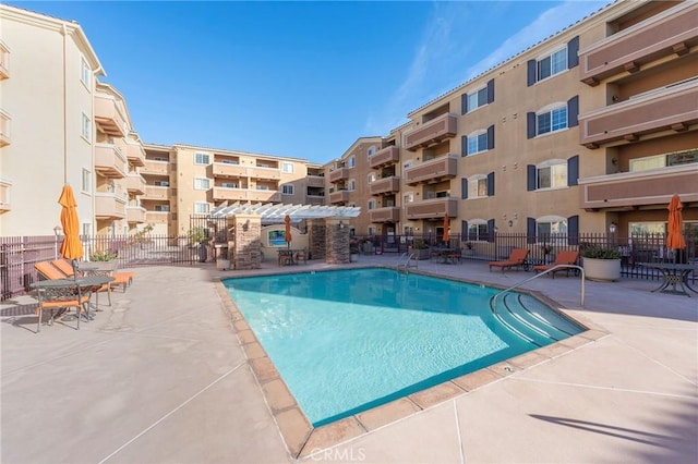 view of swimming pool with a pergola and a patio area