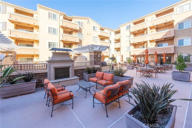 view of patio with a fireplace