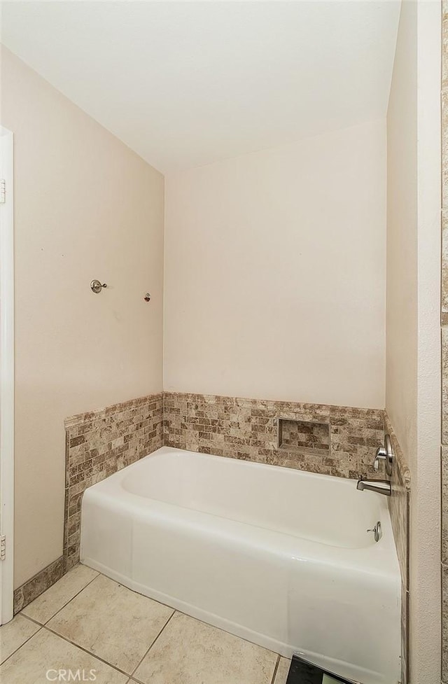 bathroom featuring a tub and tile patterned floors