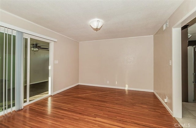 unfurnished room with ceiling fan, a textured ceiling, and hardwood / wood-style floors